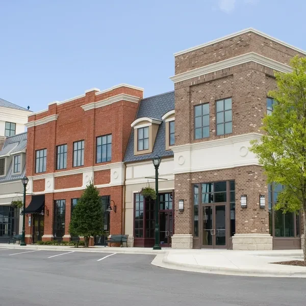 Commercial brick building representing JNR Grand Realty's family history in real estate
